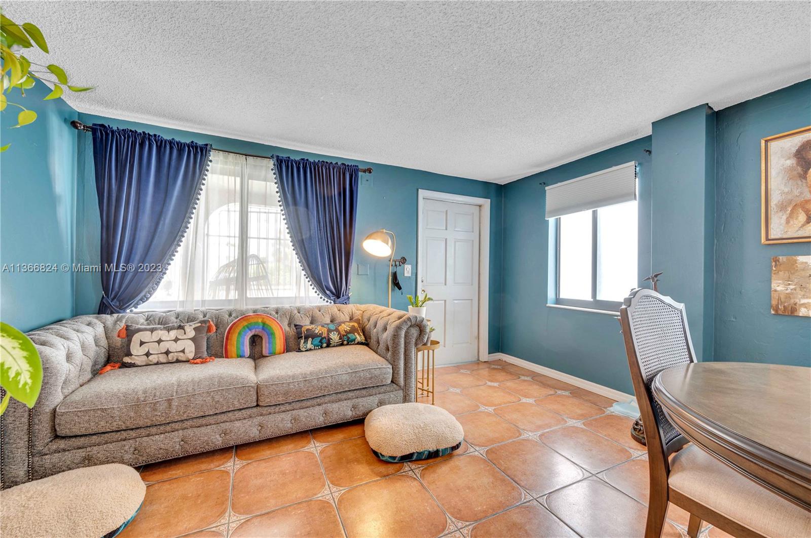 2729 Southwest 67th Avenue Miami, FL 33155 - Photo 13 of 37 a living room with furniture and a large window