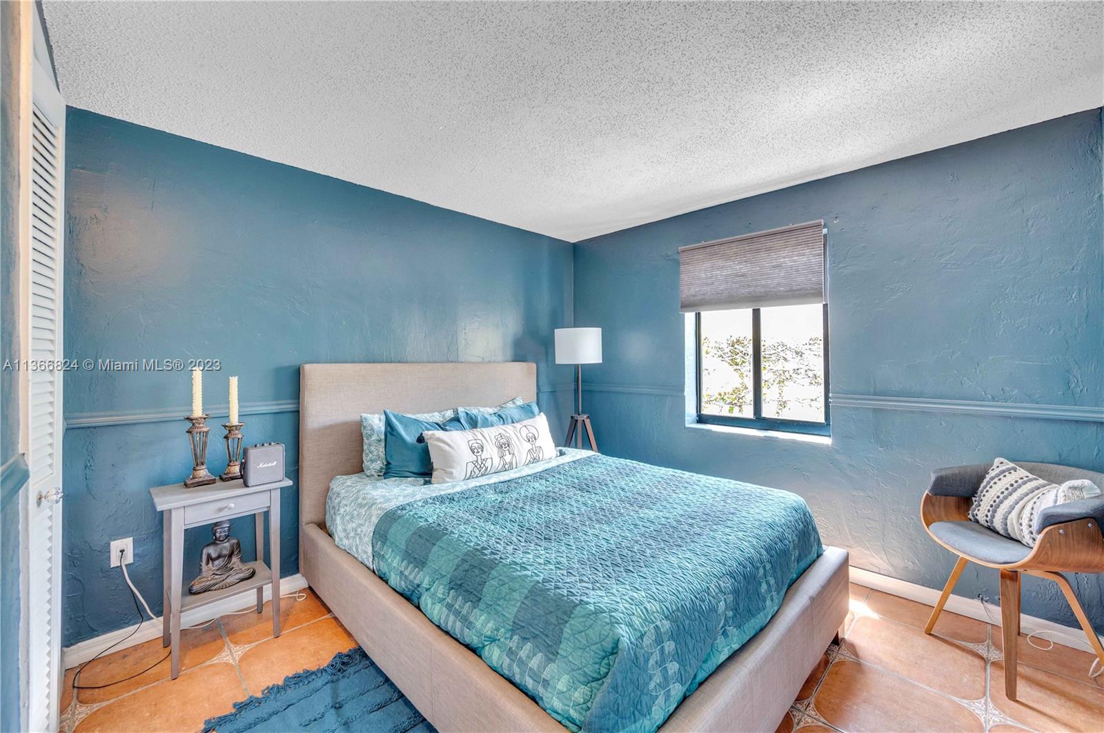 2729 Southwest 67th Avenue Miami, FL 33155 - Photo 17 of 37 a bedroom with a bed a chair and potted plant on the dresser