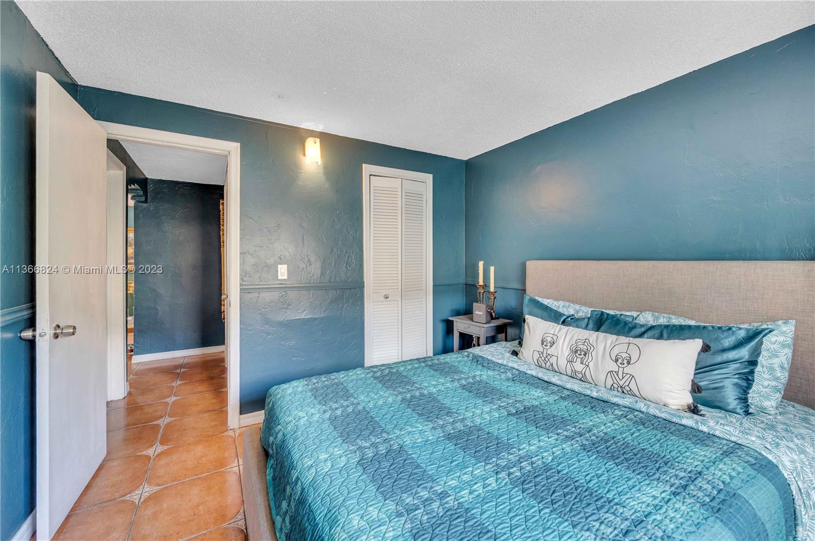2729 Southwest 67th Avenue Miami, FL 33155 - Photo 18 of 37 a bedroom with a bed and a mirror