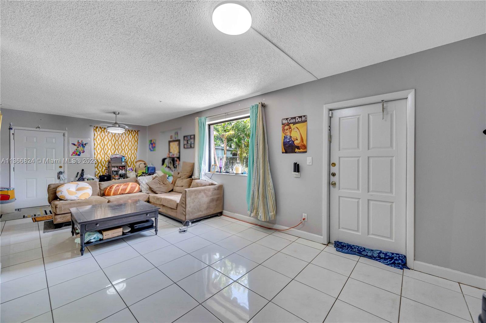 2729 Southwest 67th Avenue Miami, FL 33155 - Photo 22 of 37 a living room with furniture and a window