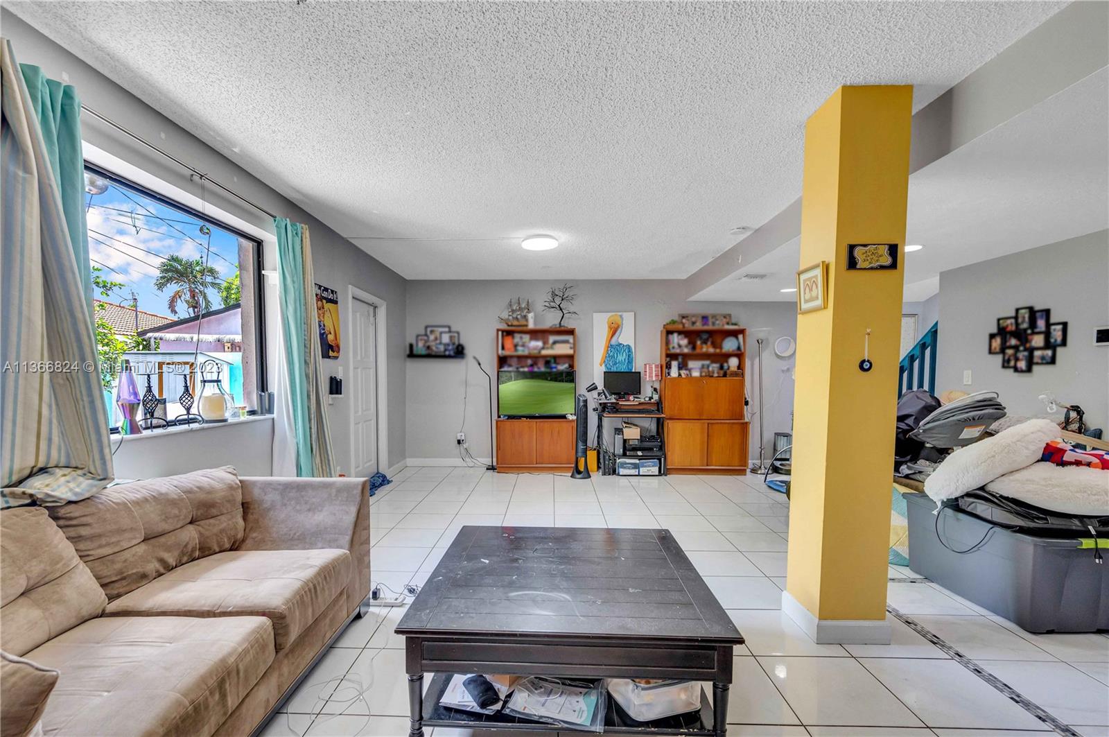 2729 Southwest 67th Avenue Miami, FL 33155 - Photo 23 of 37 a living room with furniture and window