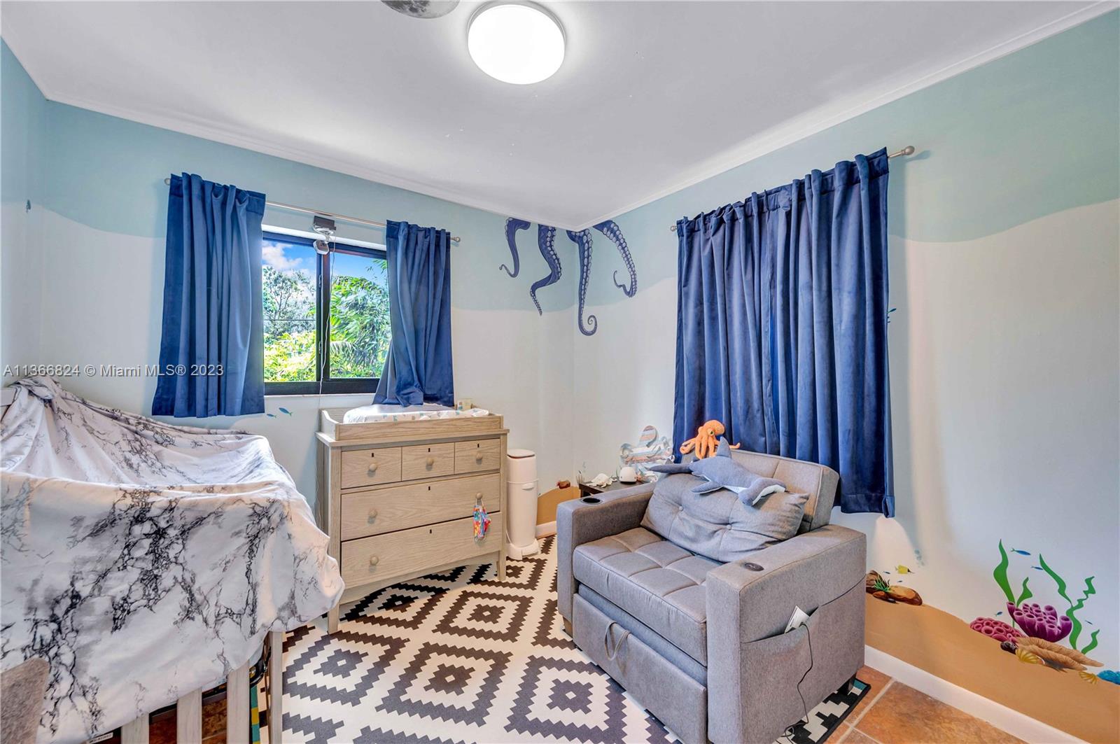 2729 Southwest 67th Avenue Miami, FL 33155 - Photo 30 of 37 a bedroom with a bed and a window