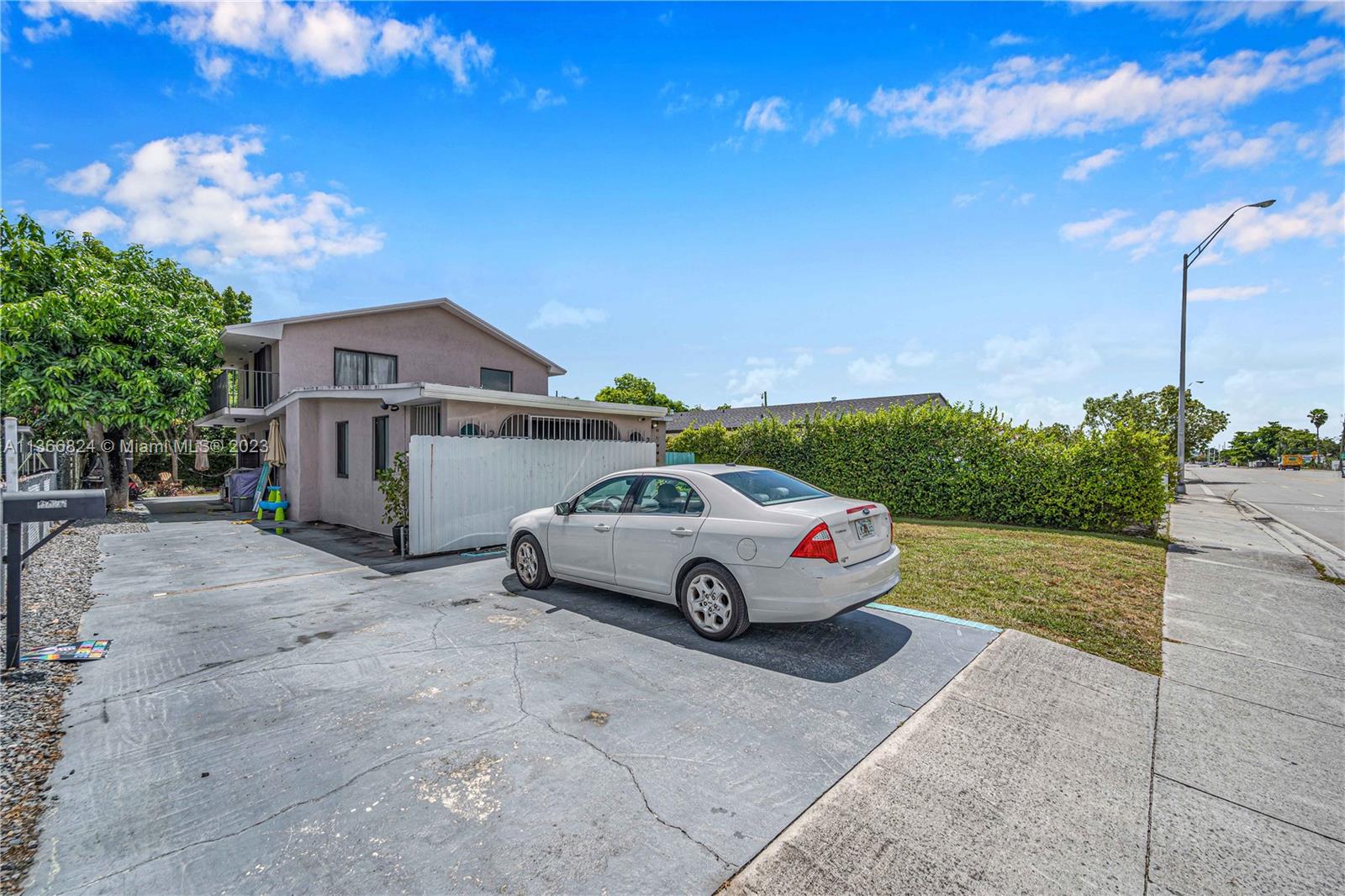 2729 Southwest 67th Avenue Miami, FL 33155 - Photo 3 of 37 a white house covered with tall trees