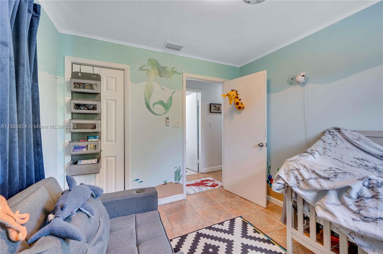 2729 Southwest 67th Avenue Miami, FL 33155 - Photo 31 of 37 a bedroom with a bed and a couch