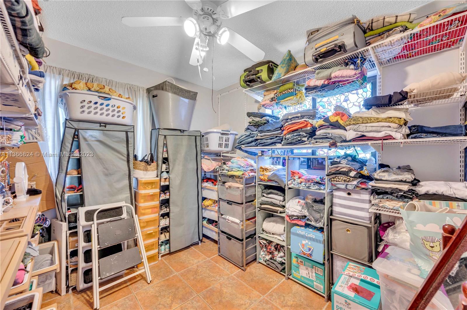 2729 Southwest 67th Avenue Miami, FL 33155 - Photo 35 of 37 a store room with lots of different colored cloths