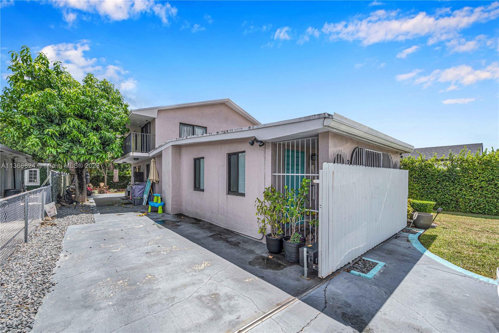 2729 Southwest 67th Avenue Miami, FL 33155 - Photo 4 of 37 a front view of a house with garden