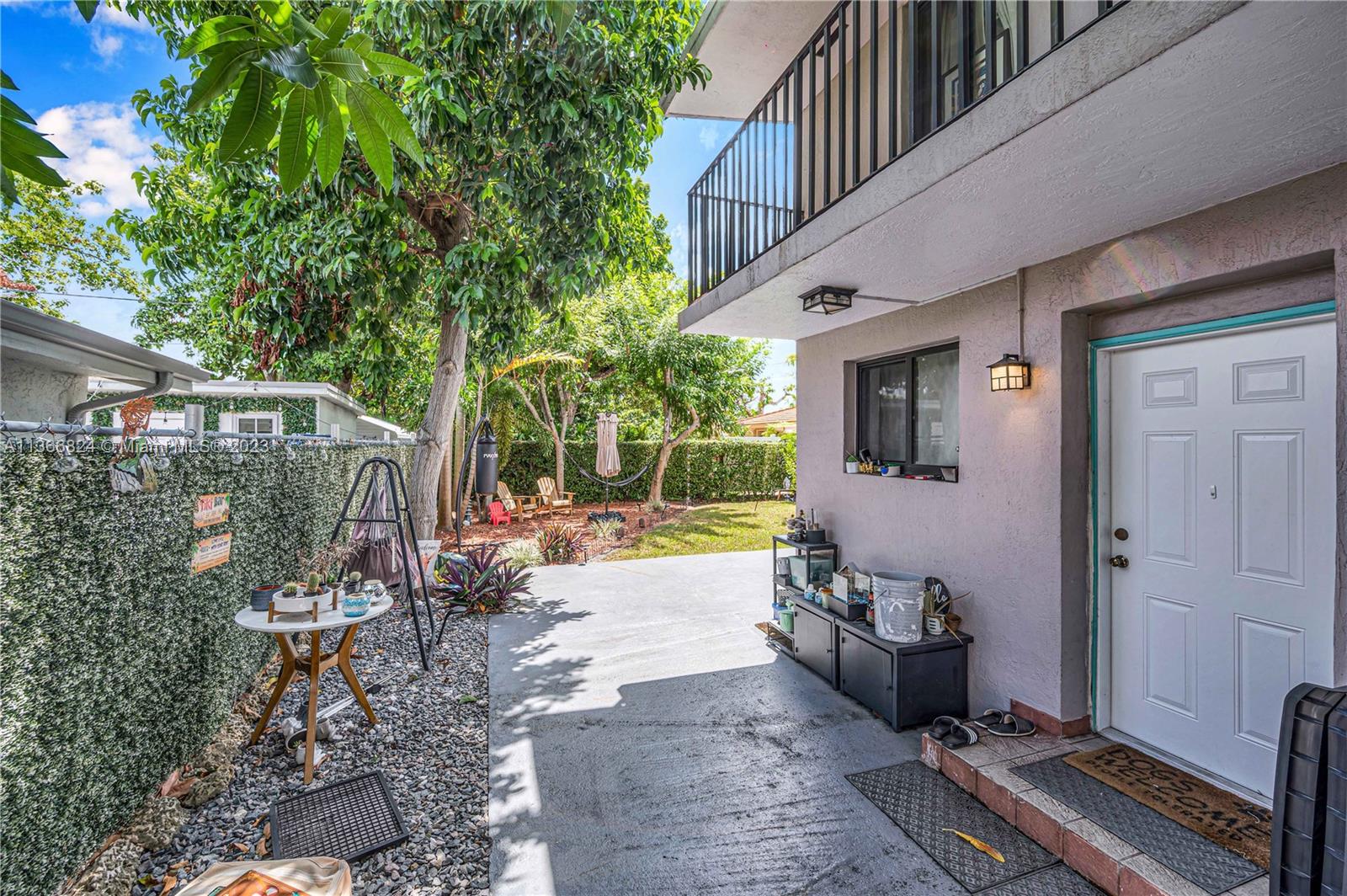 2729 Southwest 67th Avenue Miami, FL 33155 - Photo 8 of 37 a view of a porch with furniture and floor to ceiling window