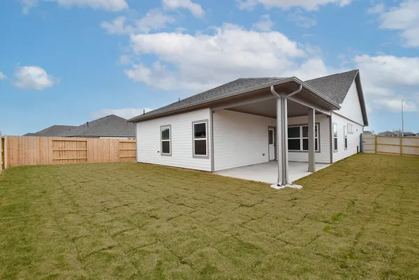 a house with yard in front of it
