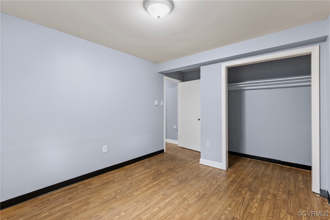 7716 Old Beach Road Chesterfield, VA 23838 - Photo 16 of 24 a view of an empty room with wooden floor and closet