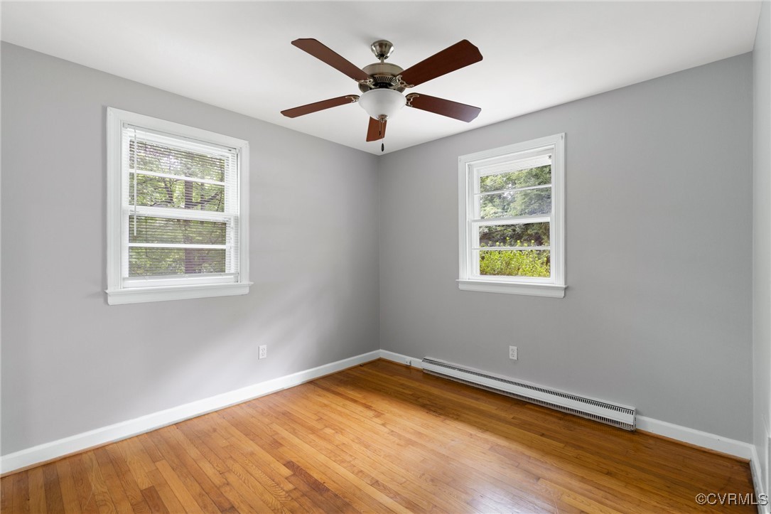 7716 Old Beach Road Chesterfield, VA 23838 - Photo 18 of 24 a view of an empty room with wooden floor and a window