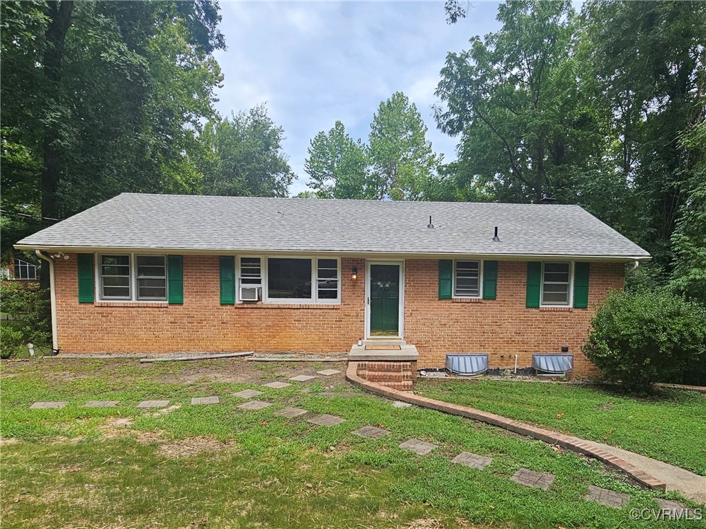 7716 Old Beach Road Chesterfield, VA 23838 - Photo 2 of 24 a front view of a house with a yard and trees