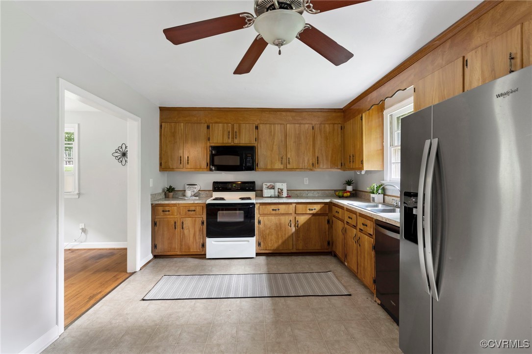 7716 Old Beach Road Chesterfield, VA 23838 - Photo 8 of 24 a kitchen with stainless steel appliances granite countertop a refrigerator a stove top oven a sink and dishwasher