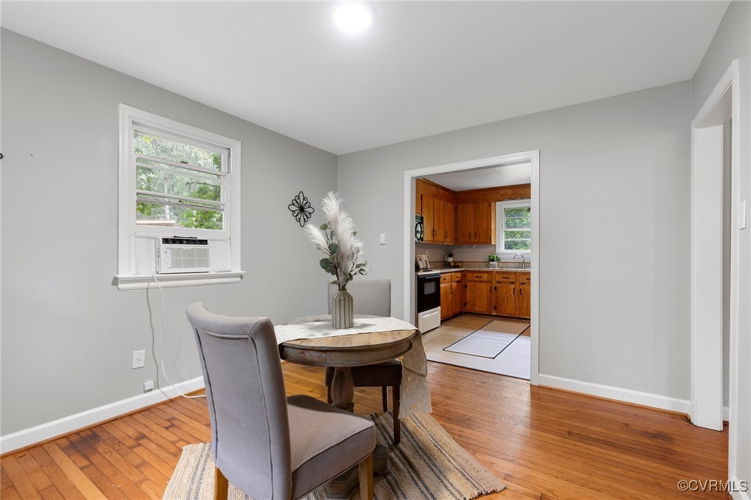 7716 Old Beach Road Chesterfield, VA 23838 - Photo 10 of 24 a workspace with furniture window and wooden floor