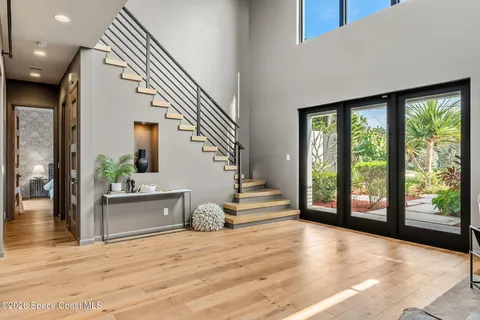 a kitchen with stainless steel appliances kitchen island granite countertop a stove top oven a sink a dining table and chairs