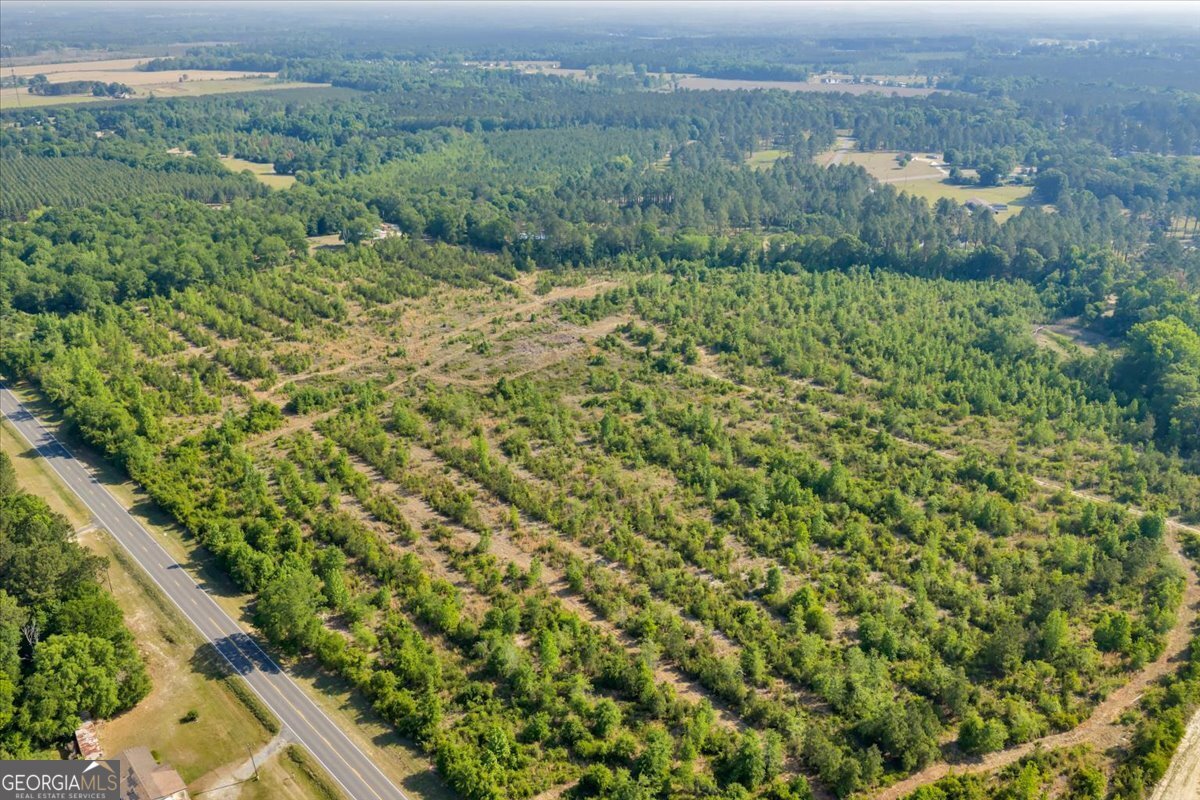 3150 Highway 441 Rentz, GA 31075 - Photo 7 of 23 an aerial view of a house with a yard
