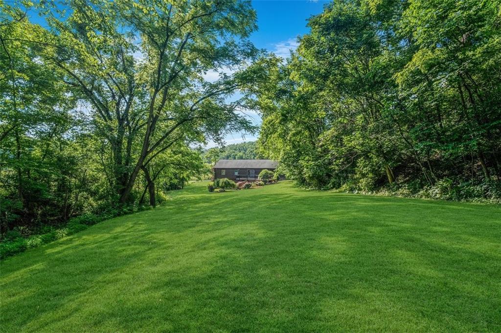 511 Markeys Road Ruffs Dale, PA 15679 - Photo 32 of 45 a view of a backyard with large trees