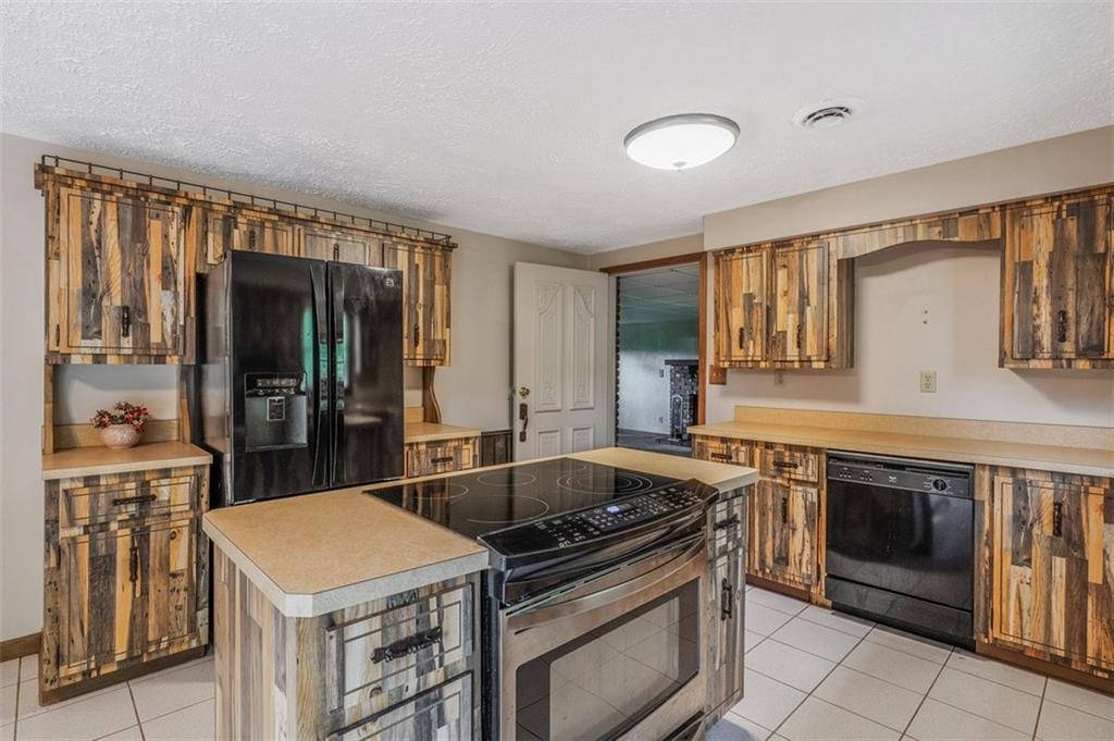 511 Markeys Road Ruffs Dale, PA 15679 - Photo 10 of 45 a kitchen that has a sink and a stove