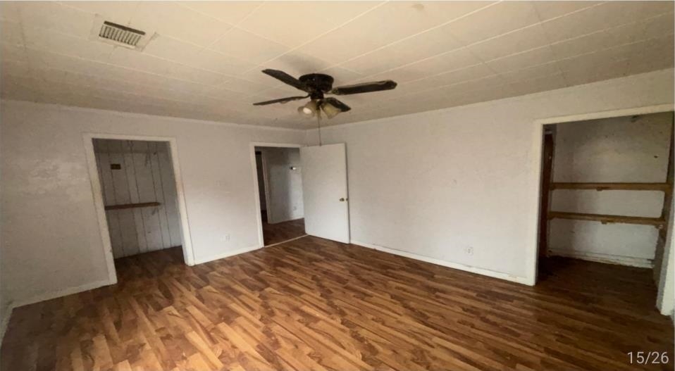 836 Mill Creek Road Troy, TN 38260 - Photo 2 of 6 Spacious room featuring wood-finish flooring, white walls, and a ceiling fan