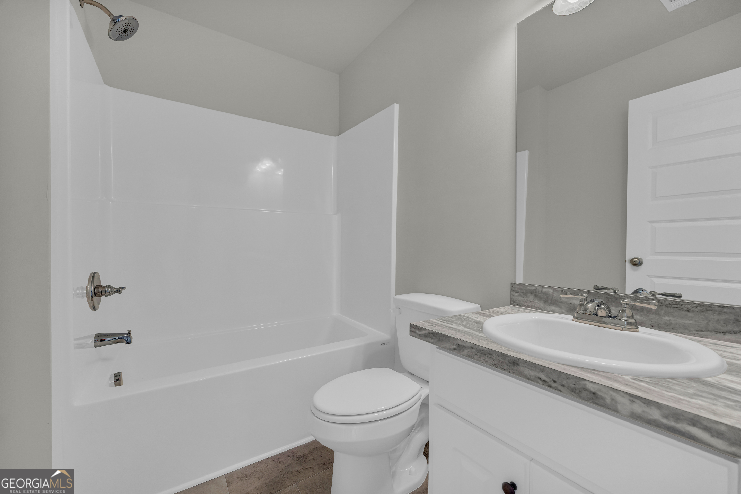 40 Sewell Road Lavonia, GA 30553 - Photo 20 of 29 a bathroom with a granite countertop sink toilet and shower