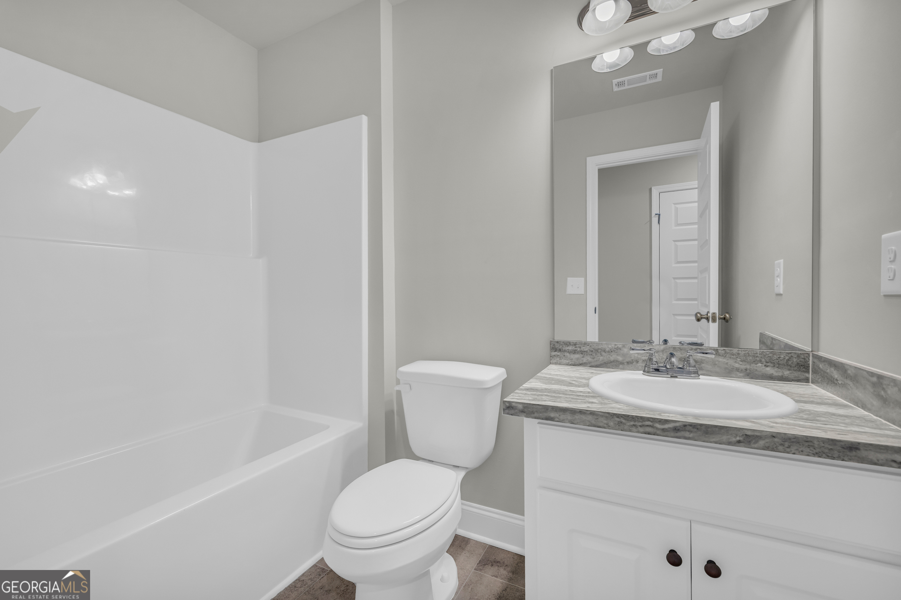 40 Sewell Road Lavonia, GA 30553 - Photo 24 of 29 a bathroom with a granite countertop sink toilet and shower