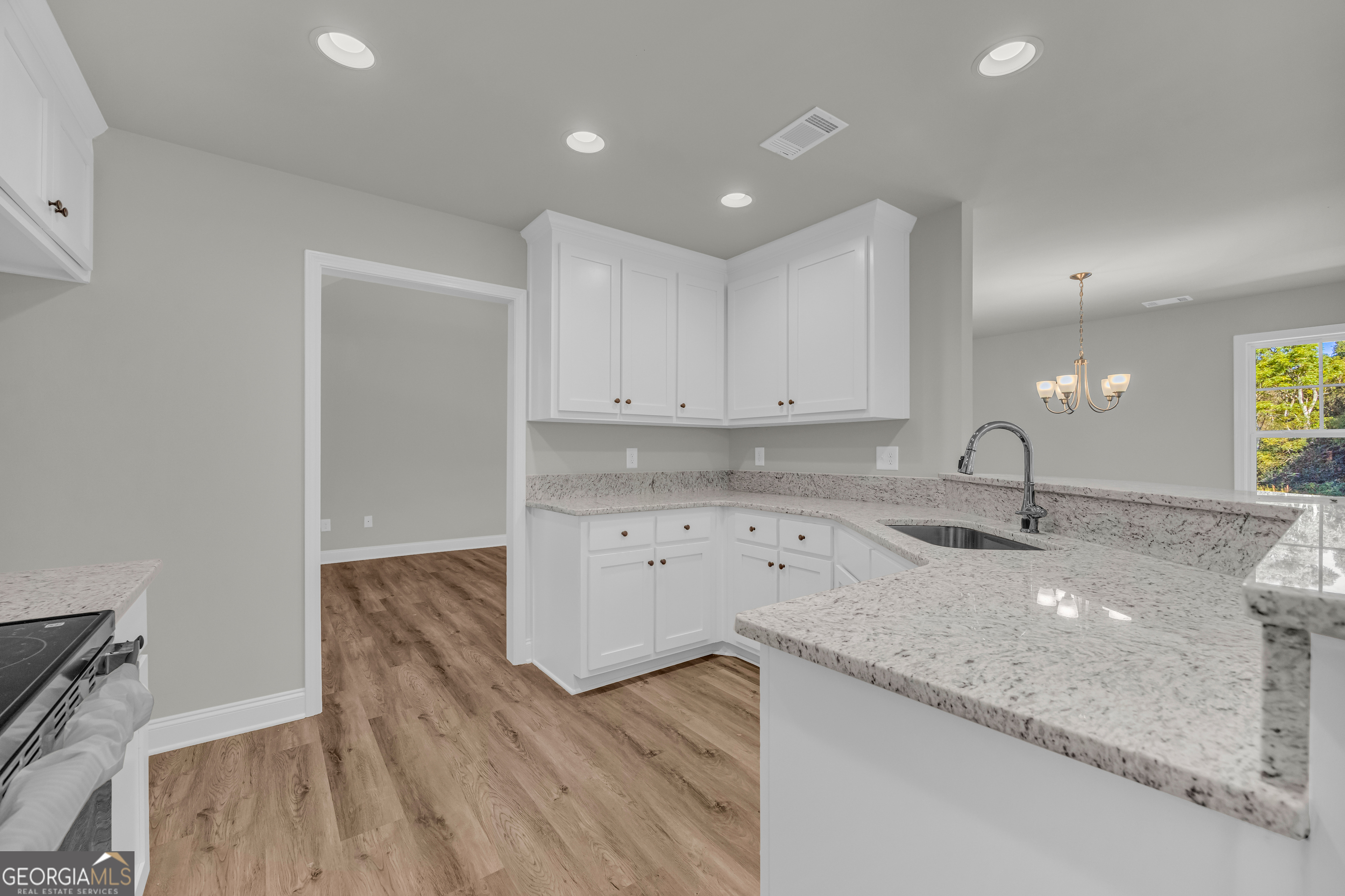 40 Sewell Road Lavonia, GA 30553 - Photo 9 of 29 a kitchen with sink and cabinets