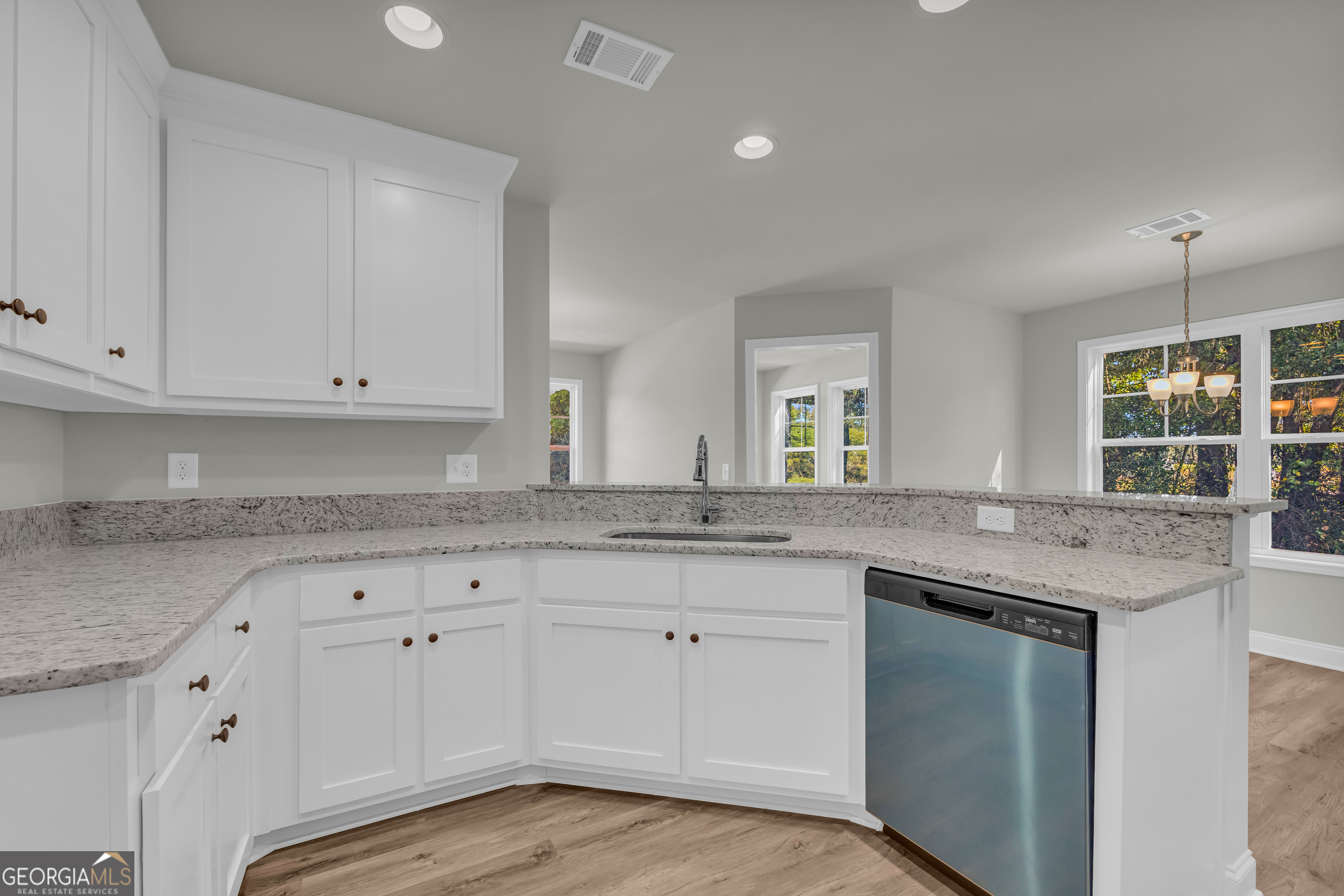 40 Sewell Road Lavonia, GA 30553 - Photo 10 of 29 a kitchen with granite countertop white cabinets and a sink