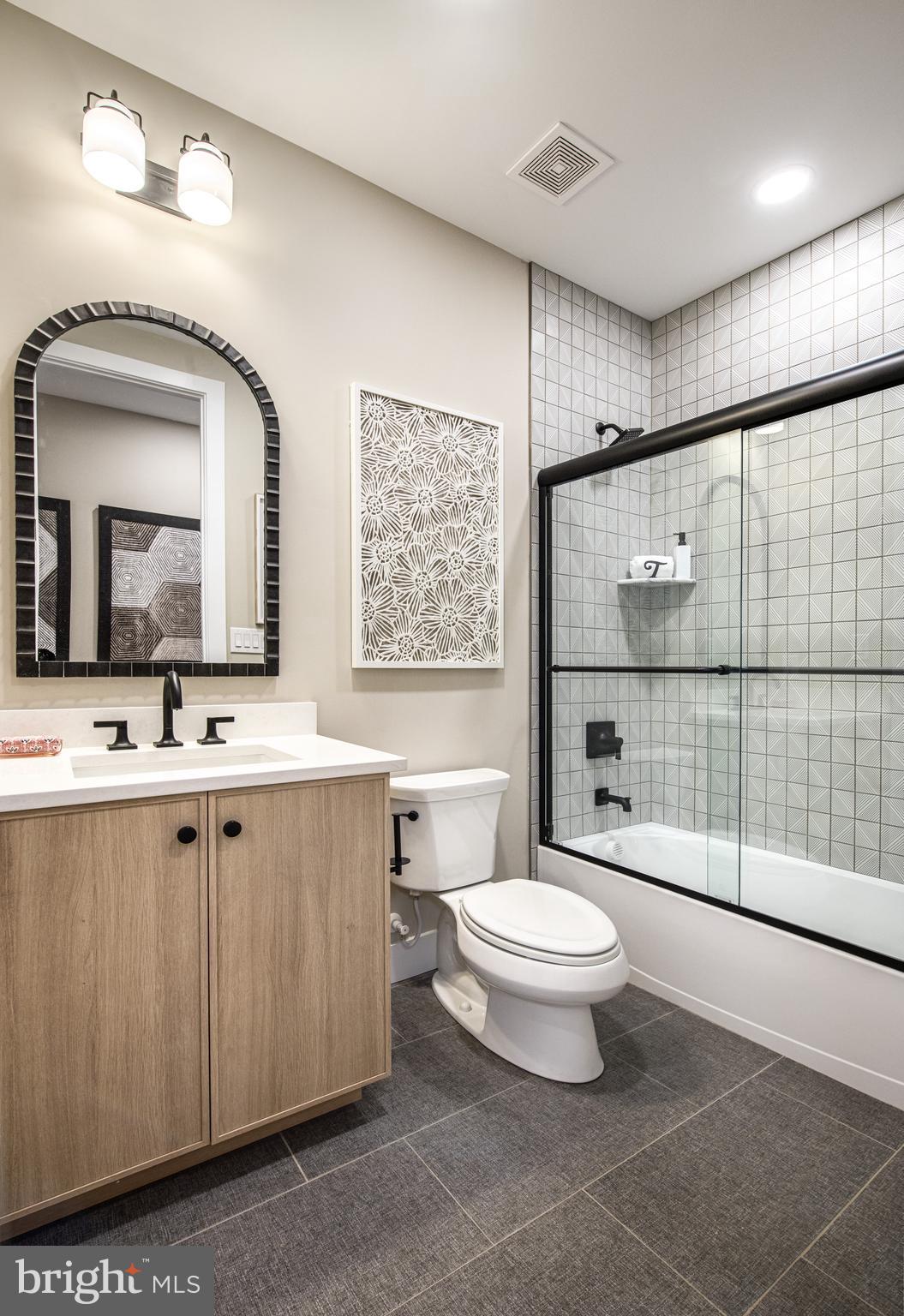 Augusta Drive, Unit ROLLINS Newtown, PA 18940 - Photo 11 of 14 a bathroom with a toilet sink and mirror