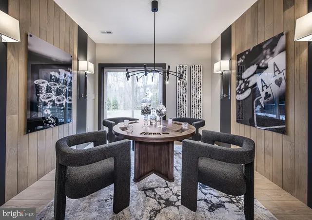 a dining room with furniture and window