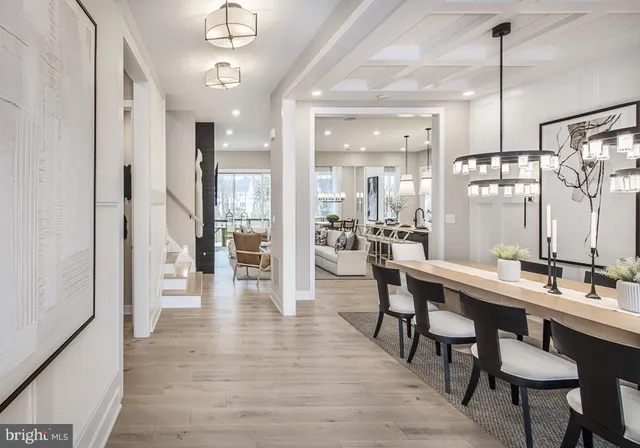 a large kitchen with a table and chairs