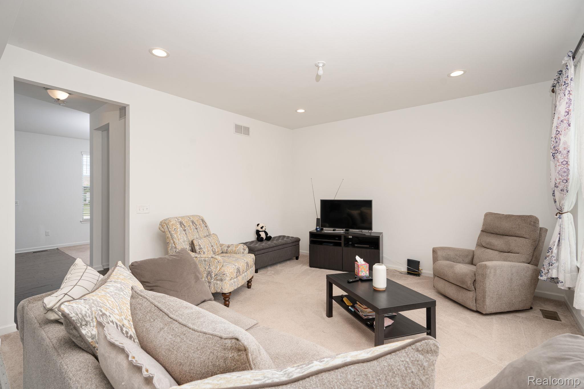 48904 Carnegie Way Macomb, MI 48042 - Photo 15 of 34 Carpeted living space featuring recessed lighting and light-toned walls