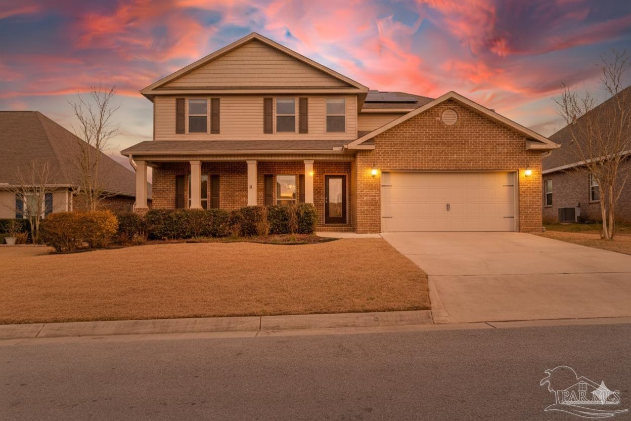 8016 Woodbrook Road Pensacola, FL 32526 - Photo 1 of 52 a front view of a house with a yard