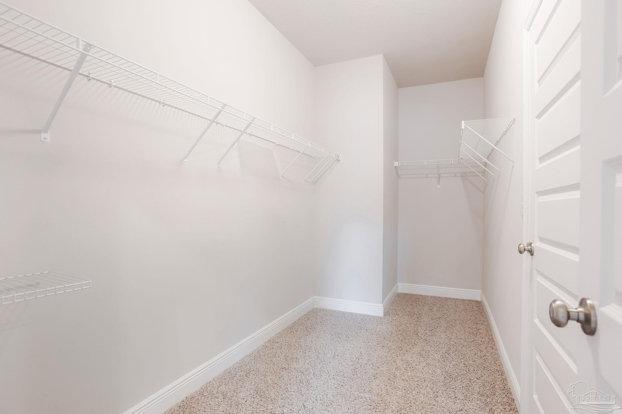 8016 Woodbrook Road Pensacola, FL 32526 - Photo 22 of 52 a view of a room with racks on the wall