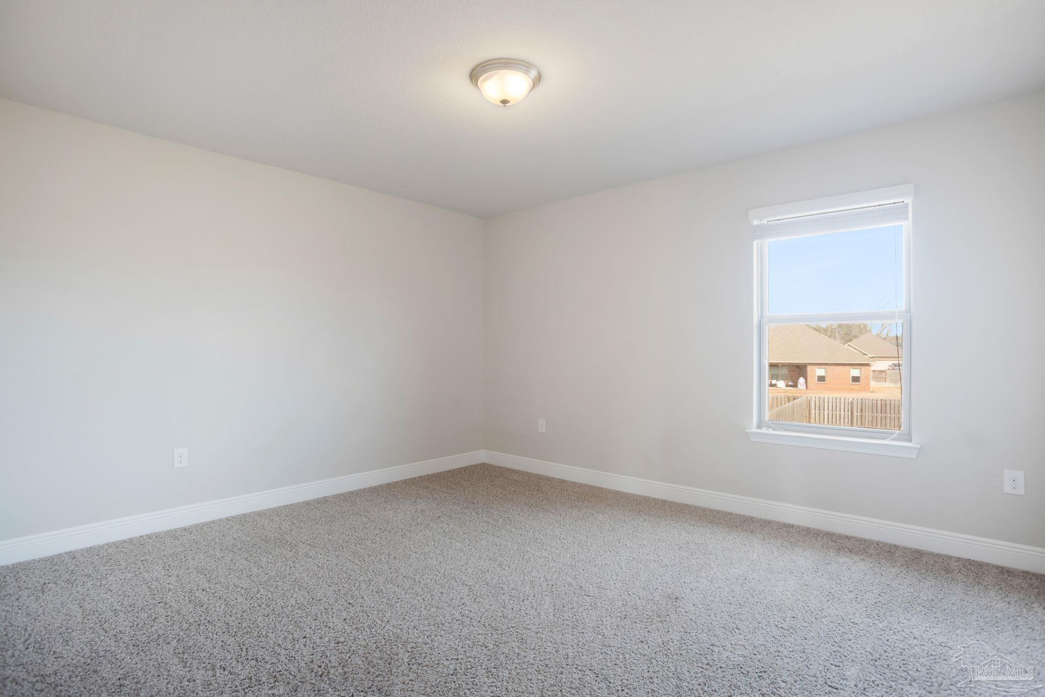 8016 Woodbrook Road Pensacola, FL 32526 - Photo 37 of 52 an empty room with a window
