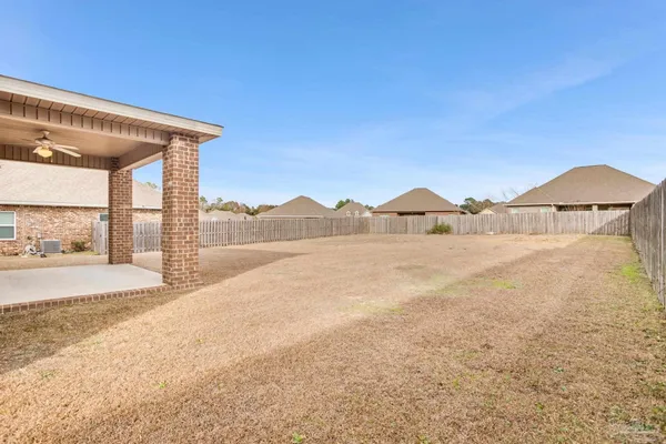 a view of a house and a yard