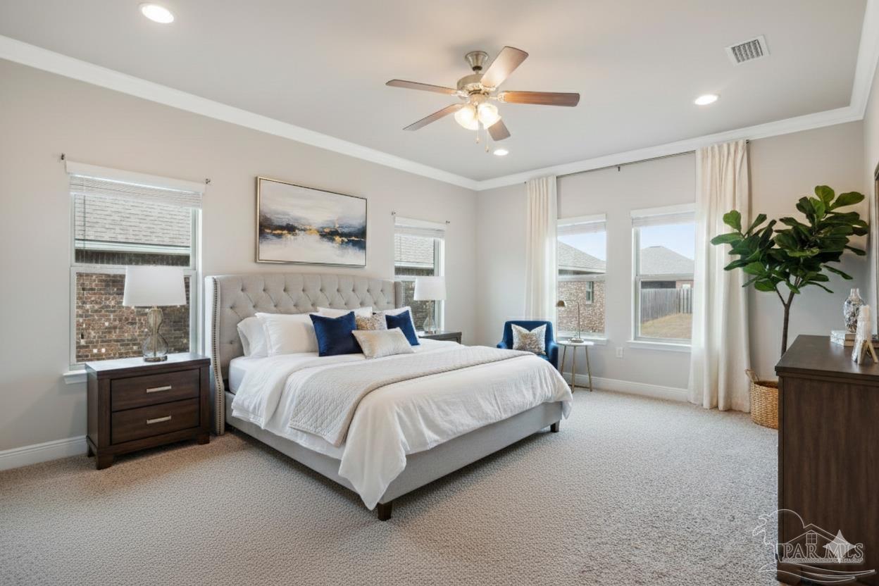 8016 Woodbrook Road Pensacola, FL 32526 - Photo 7 of 52 a bed room with a bed and a potted plant