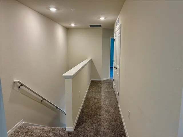 a view of hallway with stairs