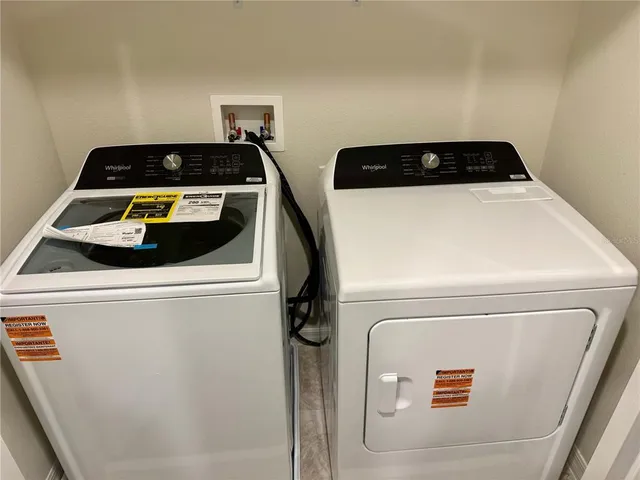a utility room with dryer and washer