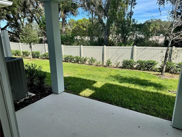 a view of a backyard with a garden and plants