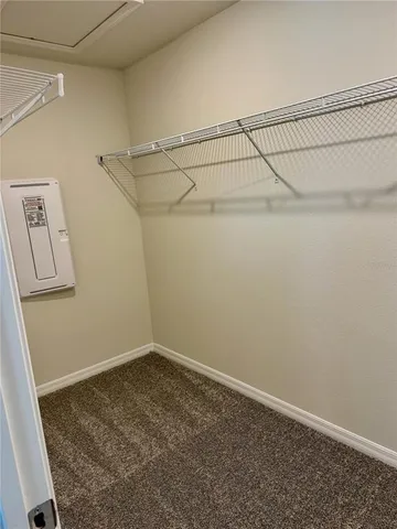 a view of a room with racks on the wall