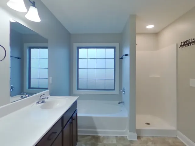a bathroom with a bathtub and a sink