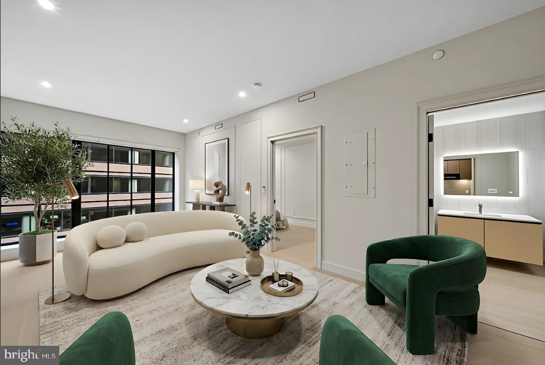 2121 Ward Place Northwest, Unit 402 Washington, DC 20037 - Photo 2 of 21 a living room with furniture and a potted plant
