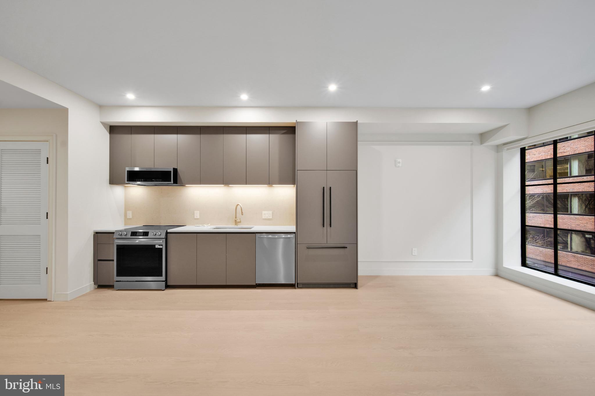 2121 Ward Place Northwest, Unit 402 Washington, DC 20037 - Photo 4 of 18 a large room with closet