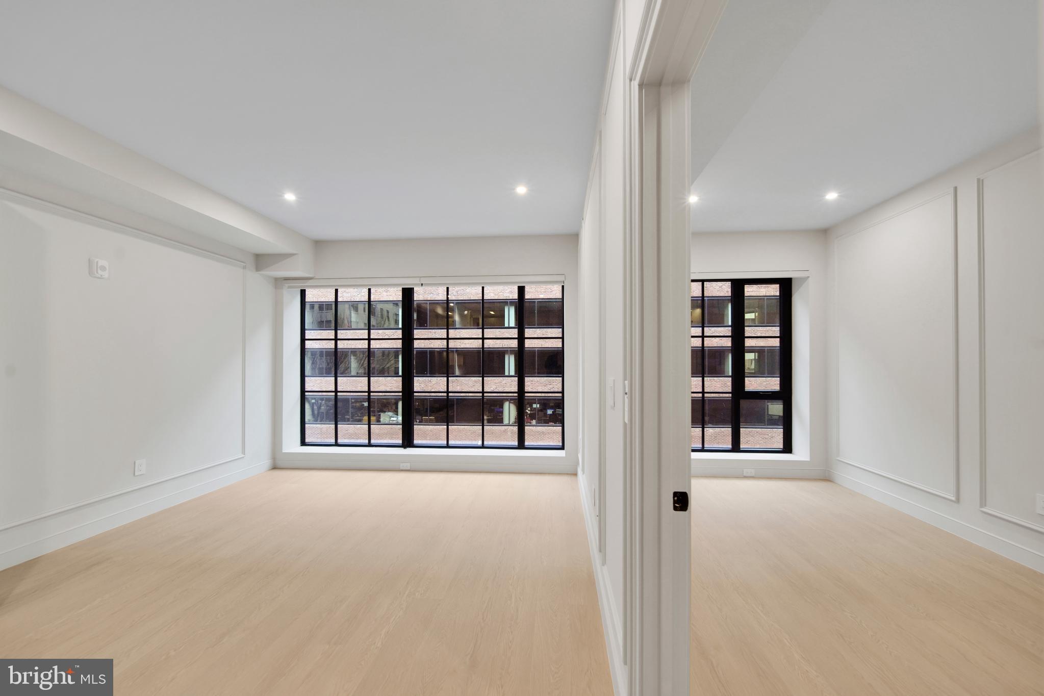 2121 Ward Place Northwest, Unit 402 Washington, DC 20037 - Photo 6 of 21 a view of an empty room with a window