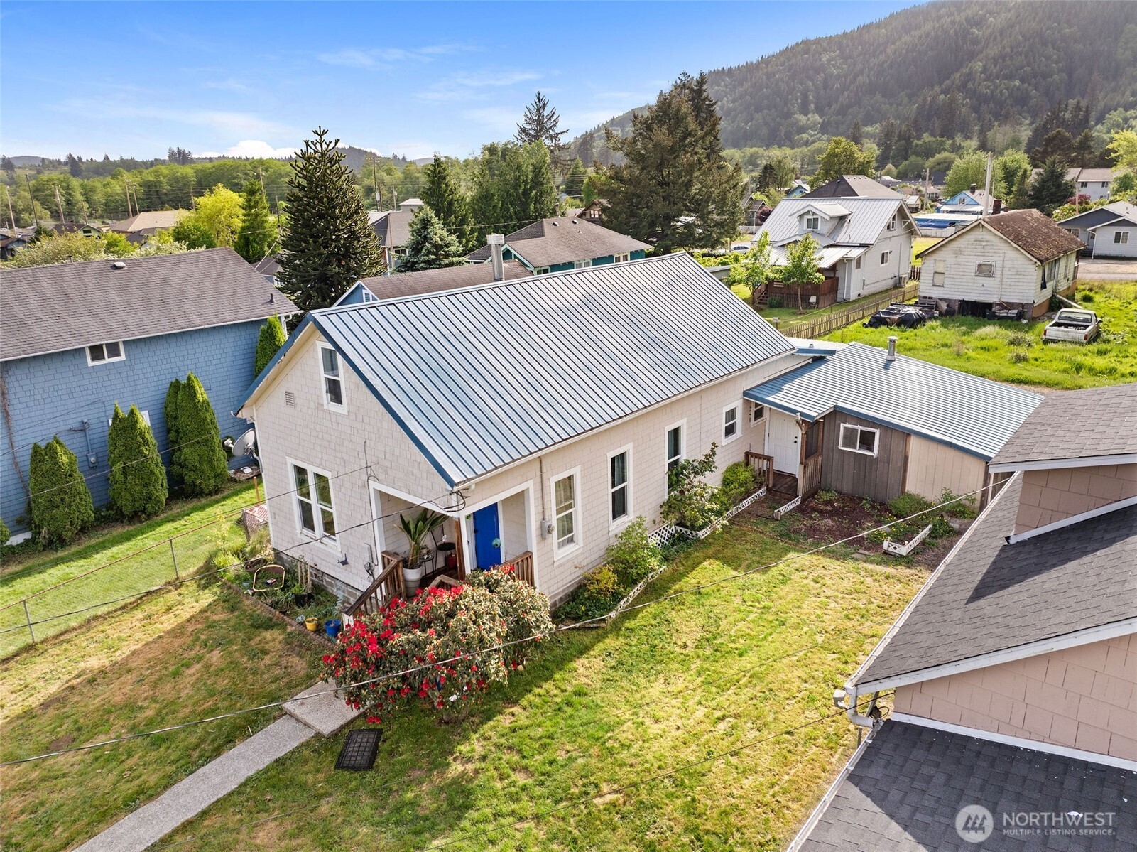 1218 Cedar Street Raymond, WA 98577 - Photo 3 of 31 an aerial view of multiple houses with a yard
