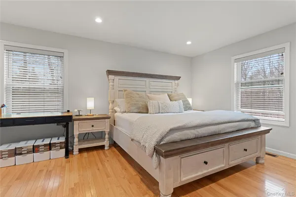 a bed room with a bed and a chair