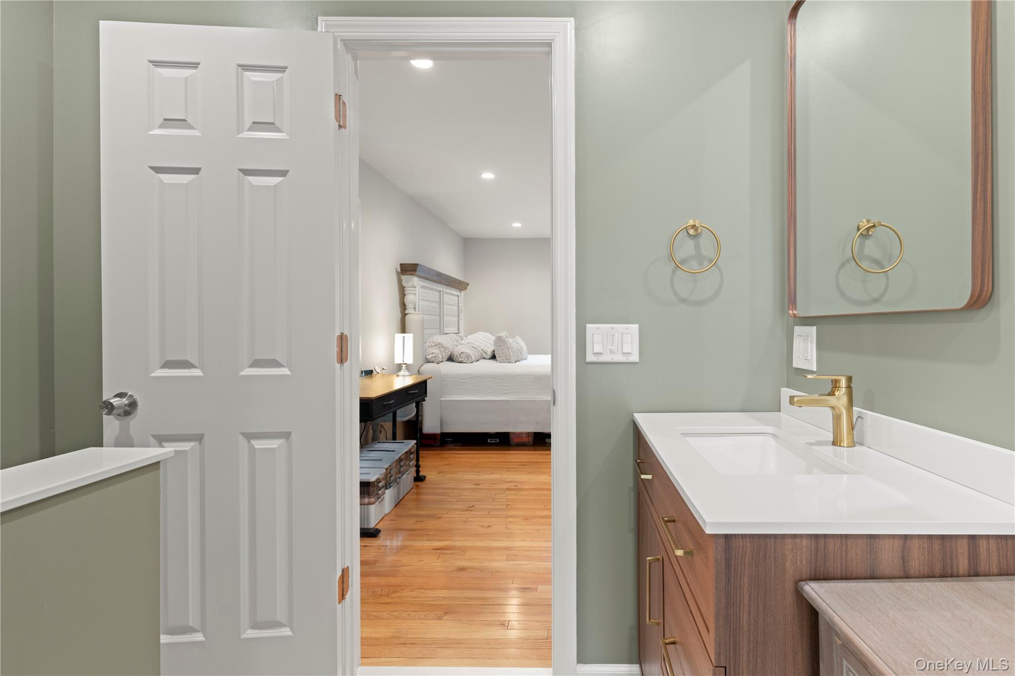 65 Beaver Road LaGrangeville, NY 12540 - Photo 17 of 40 a en suite bathroom with a sink a mirror and shower