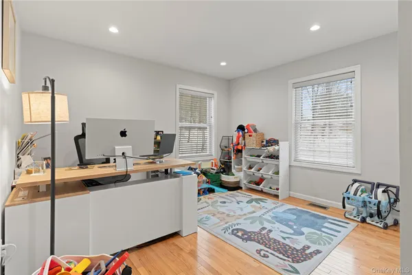 a bedroom with a bed and a television