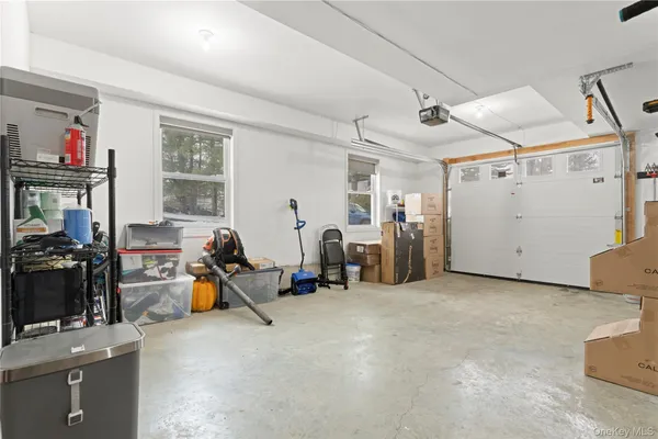a view of a garage with a bike and car
