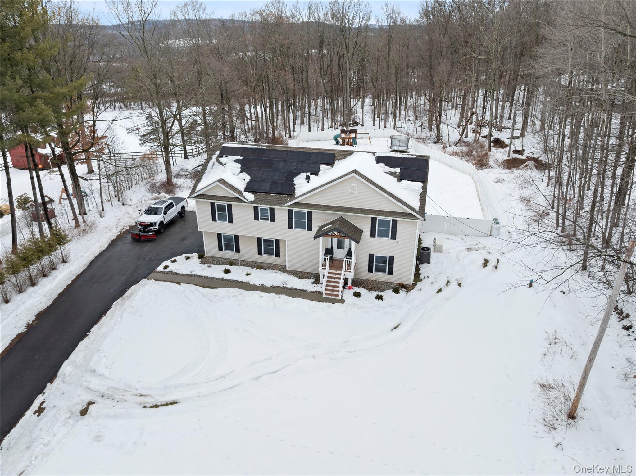 65 Beaver Road LaGrangeville, NY 12540 - Photo 40 of 40 an aerial view of a house with swimming pool and large trees
