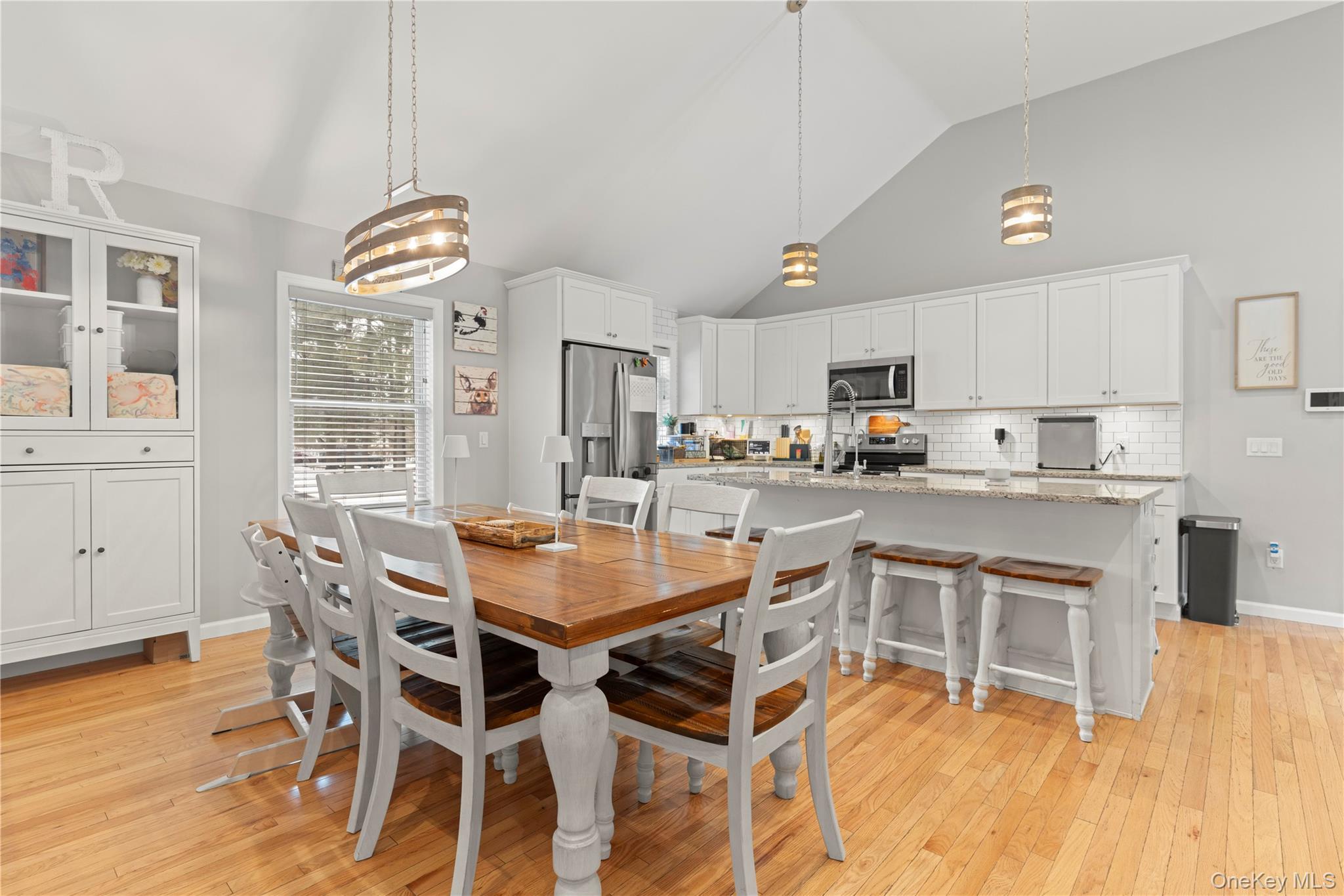 65 Beaver Road LaGrangeville, NY 12540 - Photo 4 of 40 a kitchen with stainless steel appliances kitchen island granite countertop a table chairs and a refrigerator